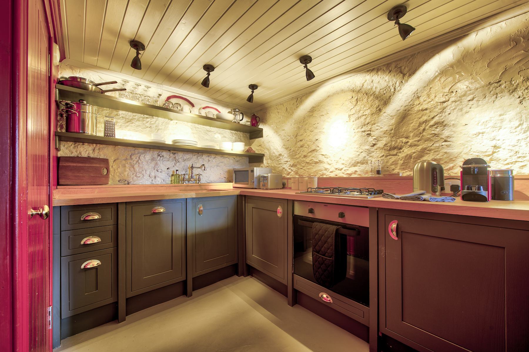 The fully equipped kitchen in the Terrace Apartment, with its serving hatch